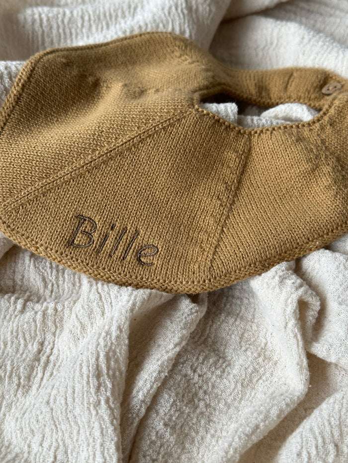 Embroidered name on bib