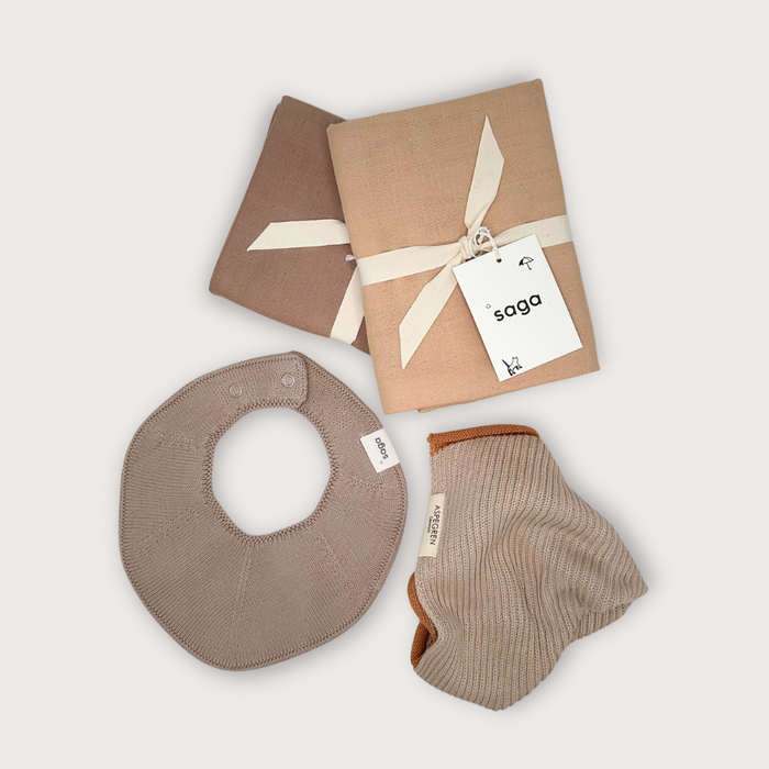 Everyday organic baby essentials gift set with two muslin cloths, knitted baby bib and organic washcloth