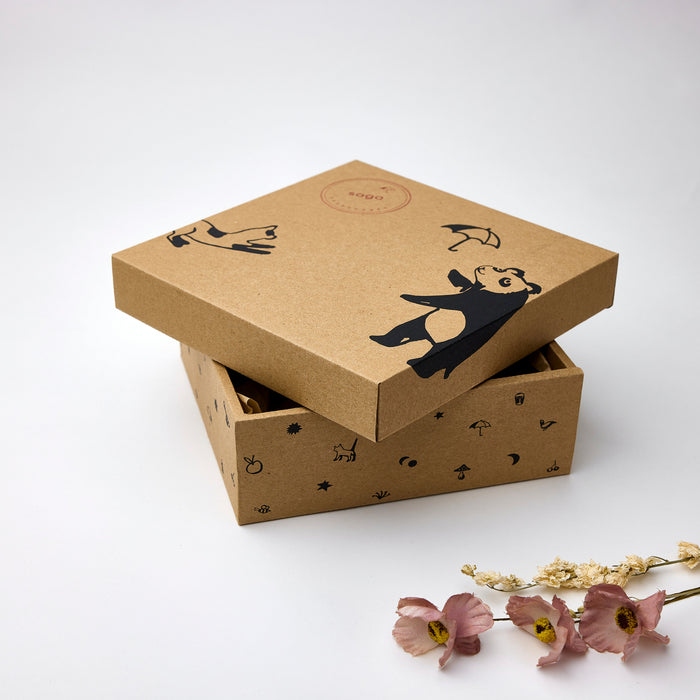 Neutral newborn gift box in soft grey tones