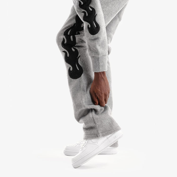 Copper Rivet Saints mohair pearl stacked gray sweat pants with ribbed cuffs and relaxed fit, featuring pearl accents on the waistband.