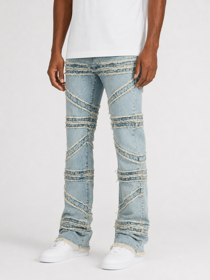 FWRD Crossover Stacked Denim jeans in Ice Tint with a stylish stacked design and denim texture.