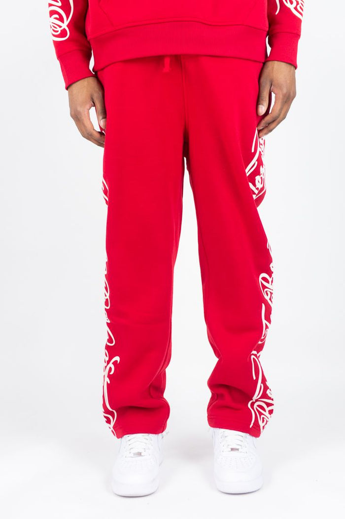 Red Rebel Minds 'Blessed' fleece sweatpants, cozy and comfortable, featuring the branded logo, perfect for casual wear.