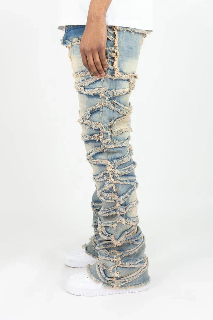 Stacked flare denim jeans by Roar Denim in light vintage wash, showcasing frayed hems and a high-waisted fit.