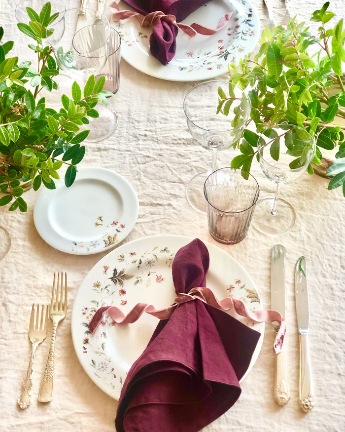 dark red rolled edge linen napkins with dark red edge 18 inch square on floral plate