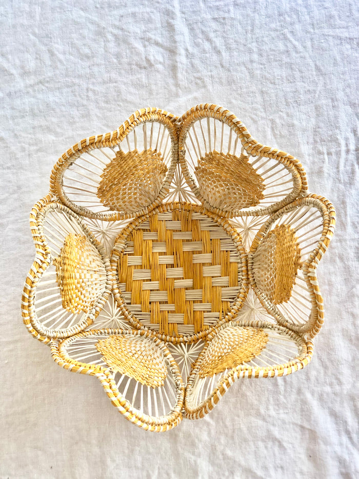 light brown and yellow round woven bread basket 8.5 inches in diameter top view