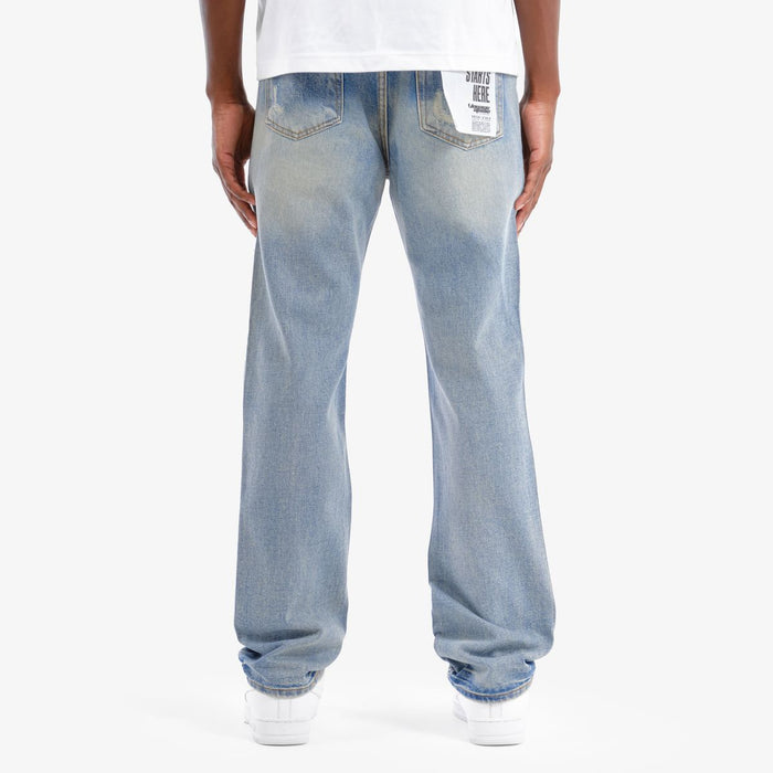 VOYAGE STUDIO Stone On Repair full rhinestone straight fit denim jeans in light blue with distressed details.